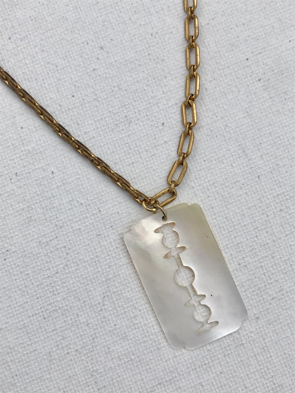 1980's Mother of Pearl Razor Blade Charm Necklace — ehra
